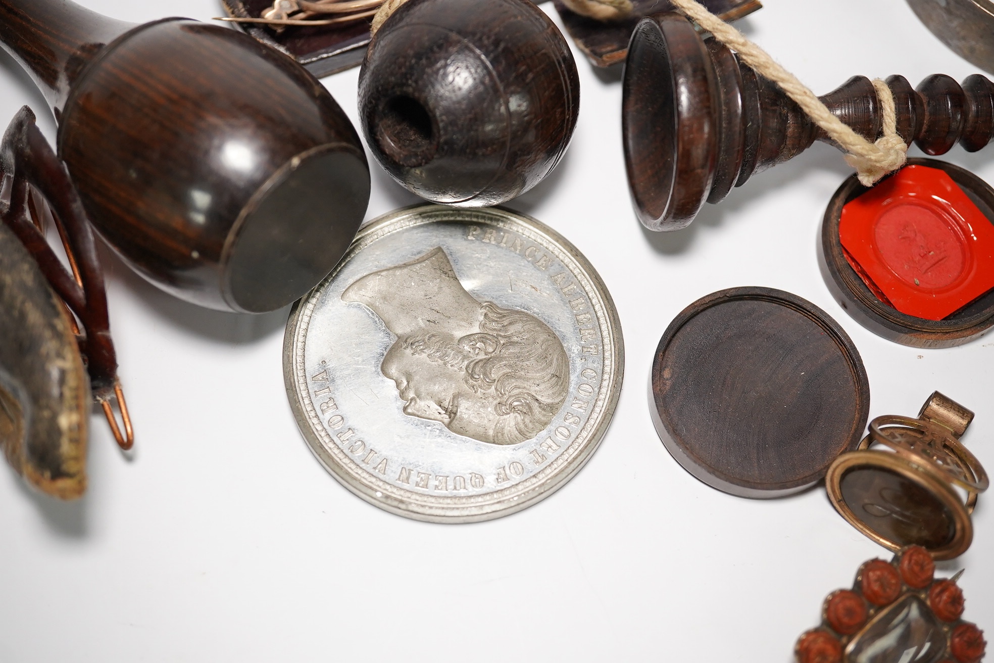 A group of various oddities to include a miser's purse, a lignum vitae ball and cup game, a mourning brooch, spectacles etc. Condition - varies